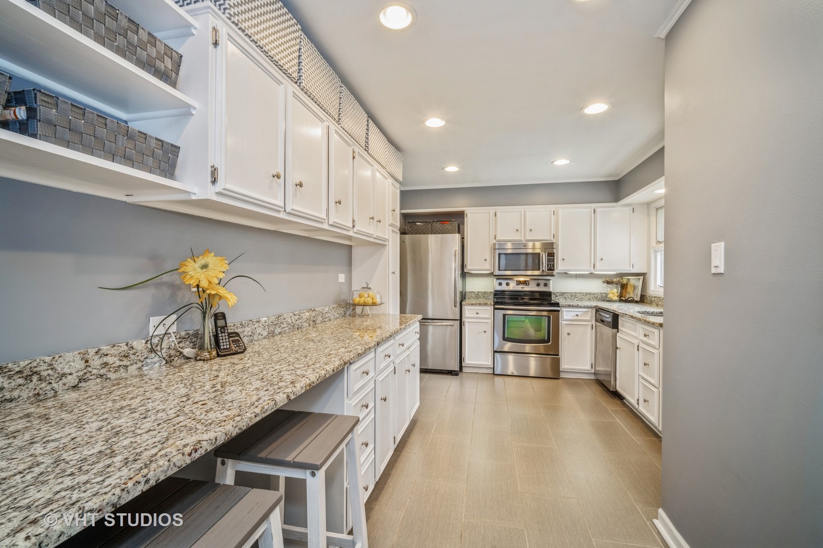 911 Dell Road Northbrook, IL 60062 - Photo 4 of 17 a kitchen with granite countertop a sink stainless steel appliances and counter space