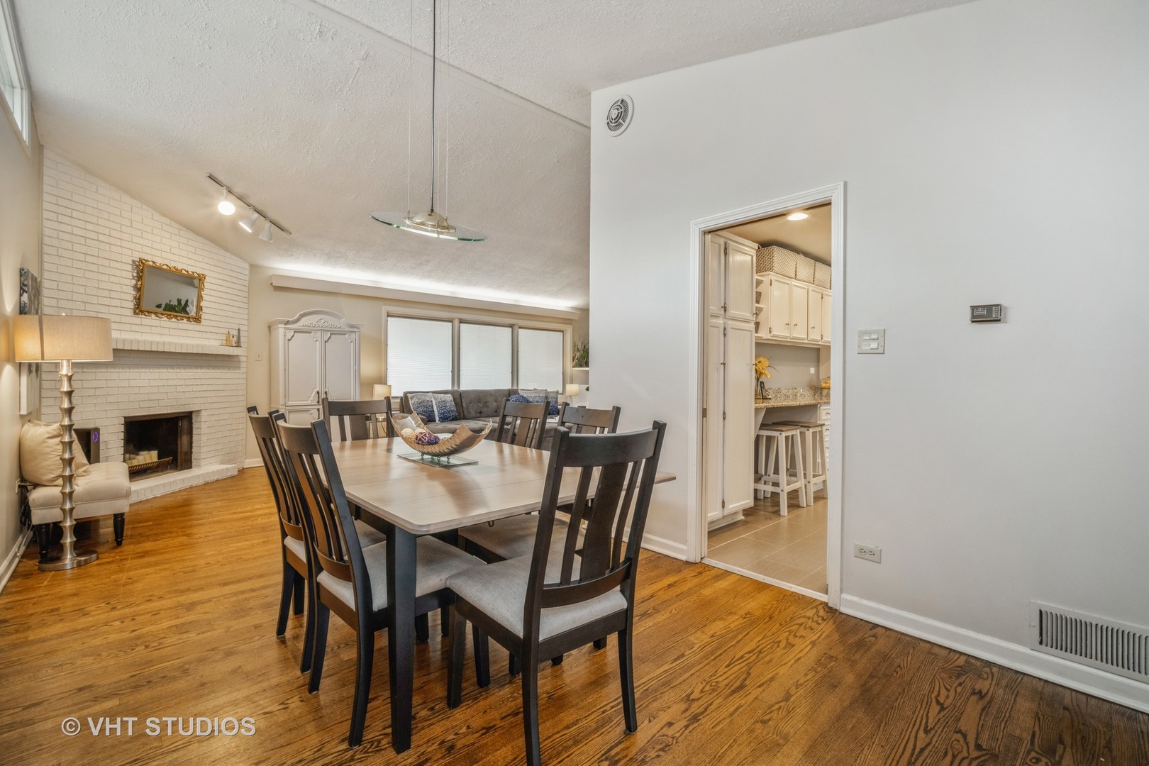 911 Dell Road Northbrook, IL 60062 - Photo 7 of 17 a view of a dining room with furniture window and wooden floor