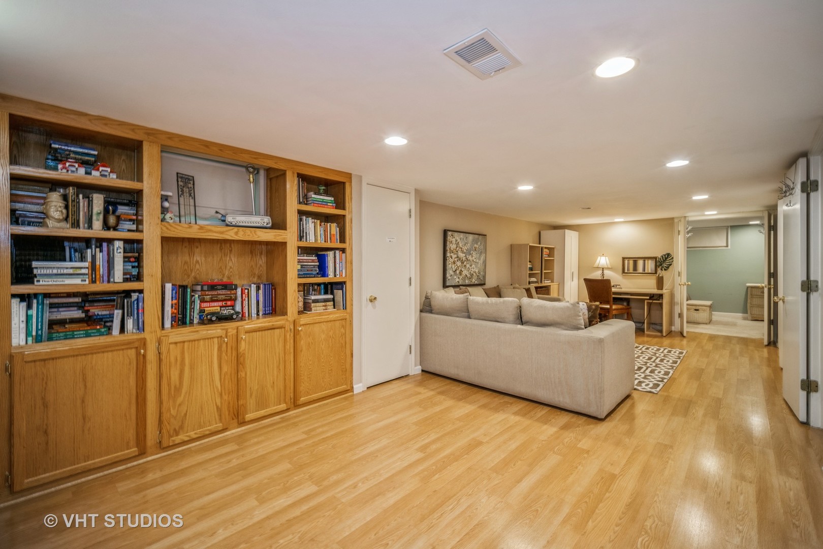 911 Dell Road Northbrook, IL 60062 - Photo 9 of 17 a living room with furniture and a book shelf