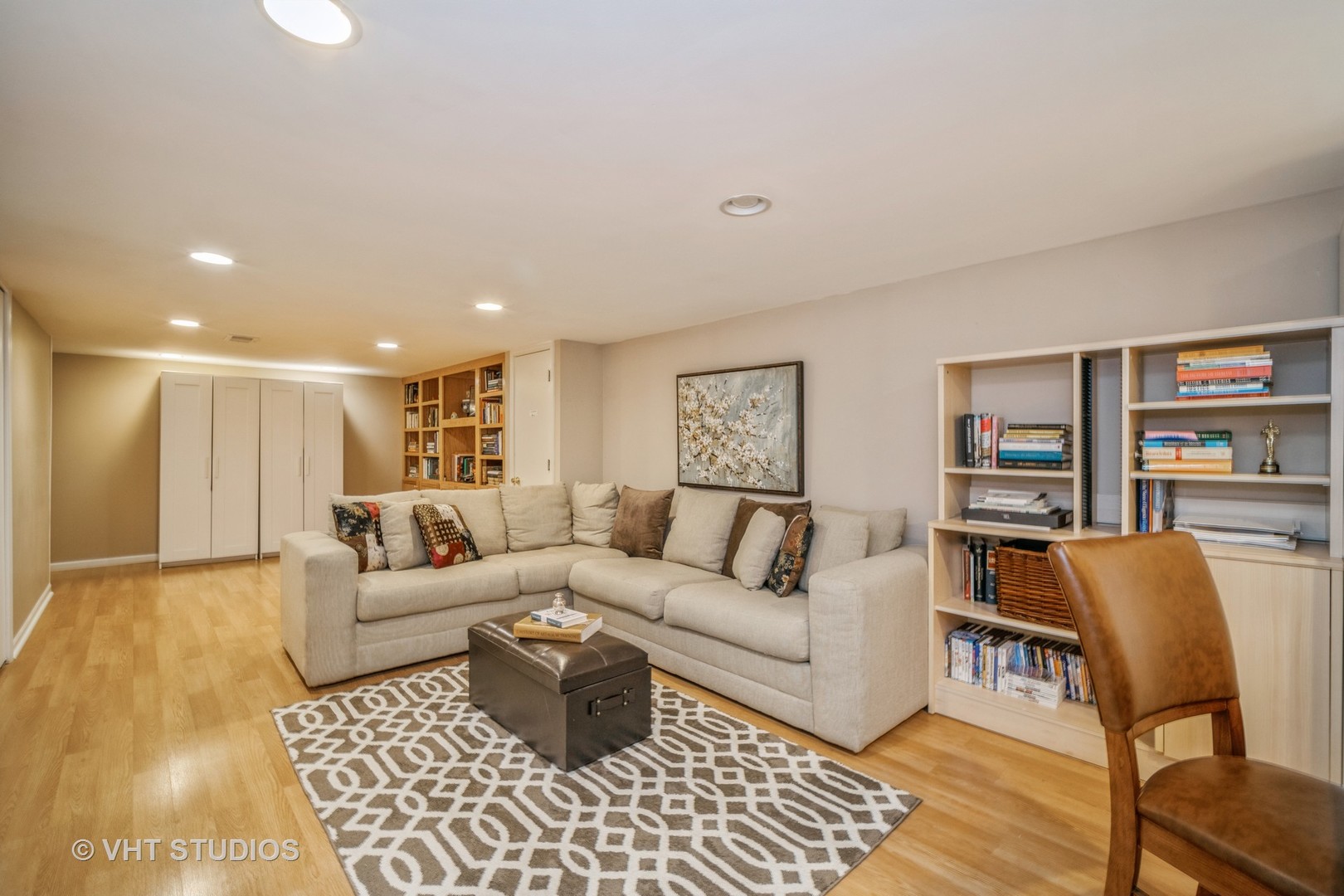 911 Dell Road Northbrook, IL 60062 - Photo 10 of 17 a living room with furniture and a book shelf