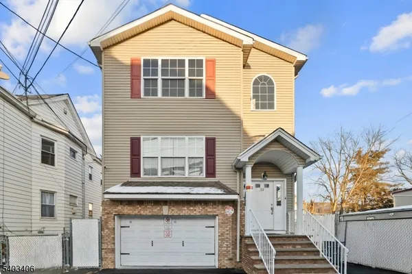 a front view of a house with a garage