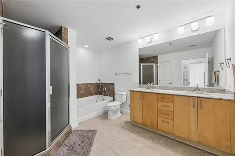 a bathroom with a toilet a sink and bathtub