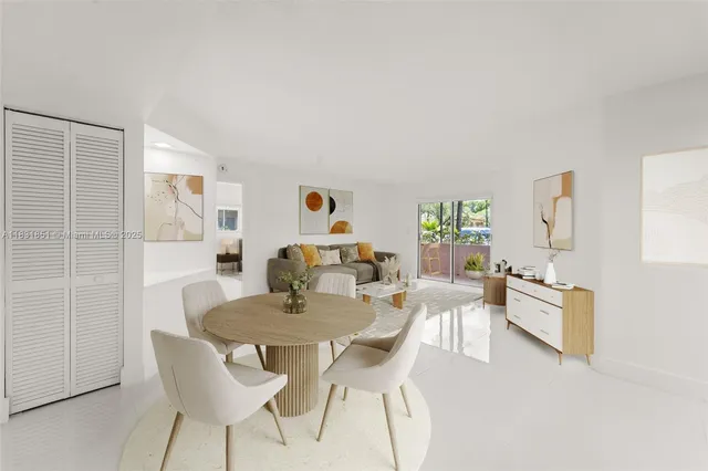 a dining room with furniture and window