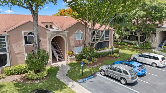 an aerial view of a residential houses with outdoor space