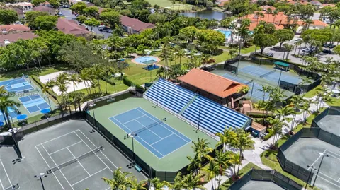 an aerial view of a house with swimming pool outdoor seating and yard