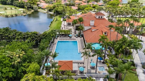 an aerial view of a house with a swimming pool yard and outdoor seating