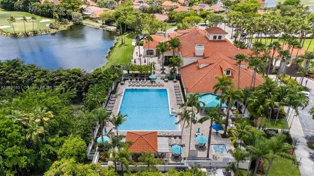 an aerial view of a house with a swimming pool yard and outdoor seating