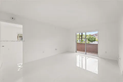 a bedroom with a balcony a bed and a couch