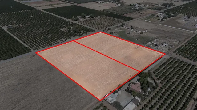 an outdoor sitting area with wooden floor