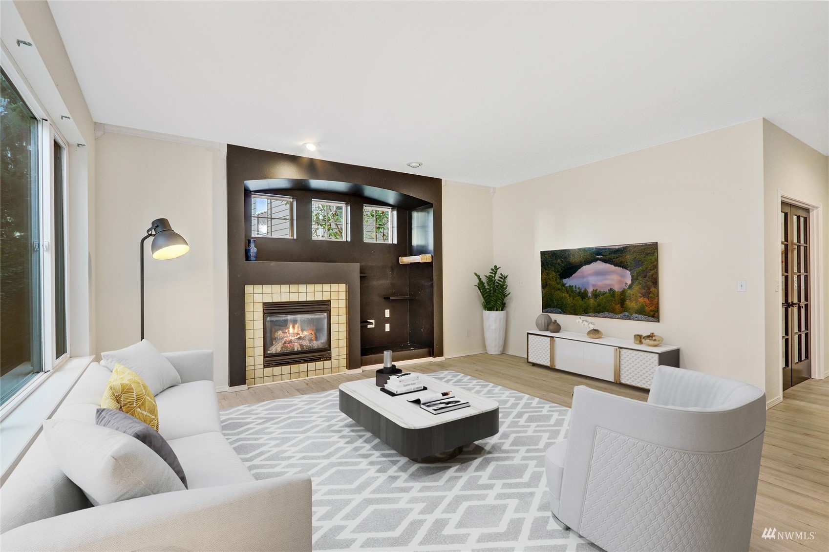 8539 Northeast 202nd Way Bothell, WA 98011 - Photo 13 of 31 a living room with furniture and a flat screen tv