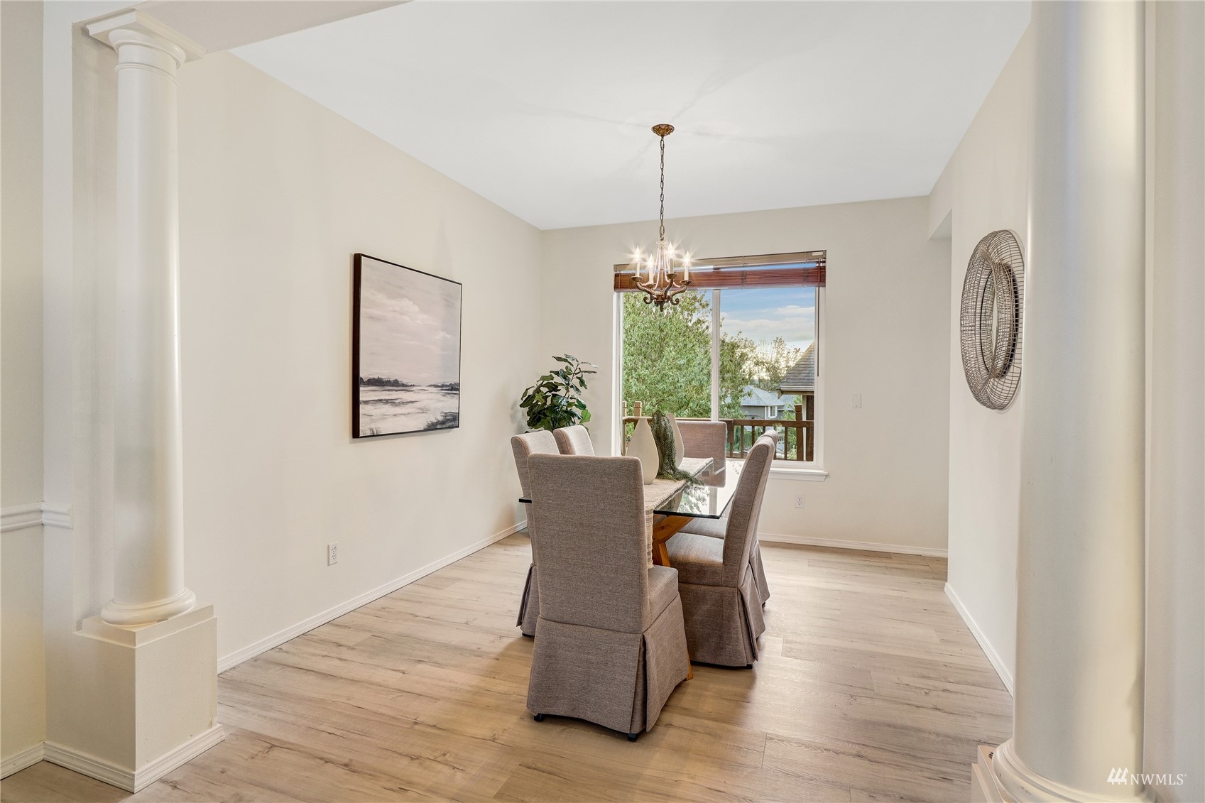 8539 Northeast 202nd Way Bothell, WA 98011 - Photo 5 of 31 a view of a dining room with furniture window and wooden floor