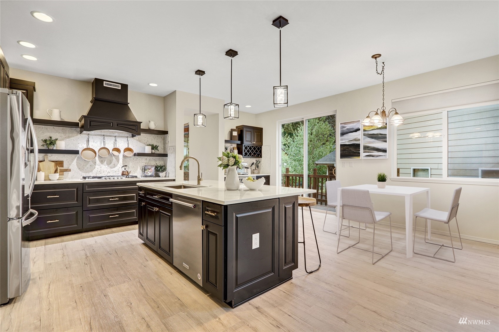 8539 Northeast 202nd Way Bothell, WA 98011 - Photo 10 of 31 a kitchen with stainless steel appliances granite countertop a stove and a wooden floors