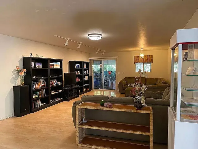 a kitchen with a refrigerator and a stove top oven
