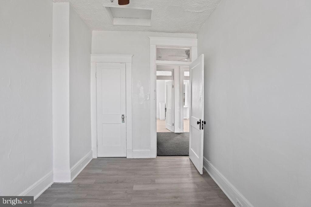 2424 West Lafayette Avenue Baltimore, MD 21216 - Photo 11 of 19 a view of a hallway with wooden floor