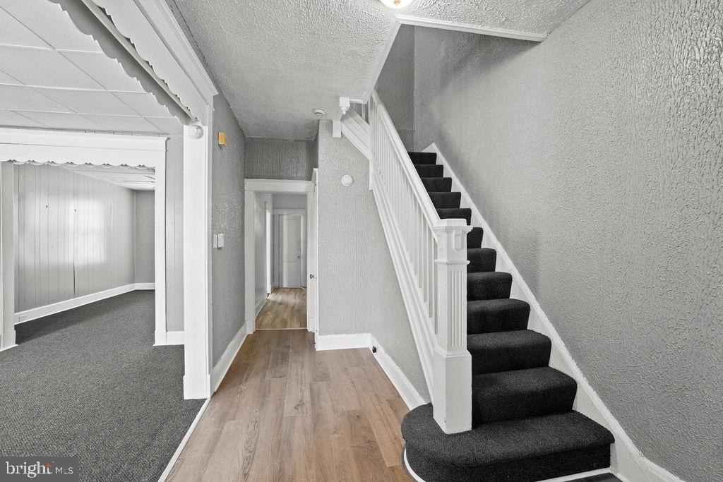 2424 West Lafayette Avenue Baltimore, MD 21216 - Photo 4 of 19 a view of entryway and hall with wooden floor