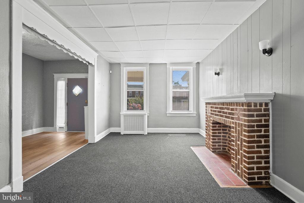 2424 West Lafayette Avenue Baltimore, MD 21216 - Photo 5 of 19 an empty room with windows