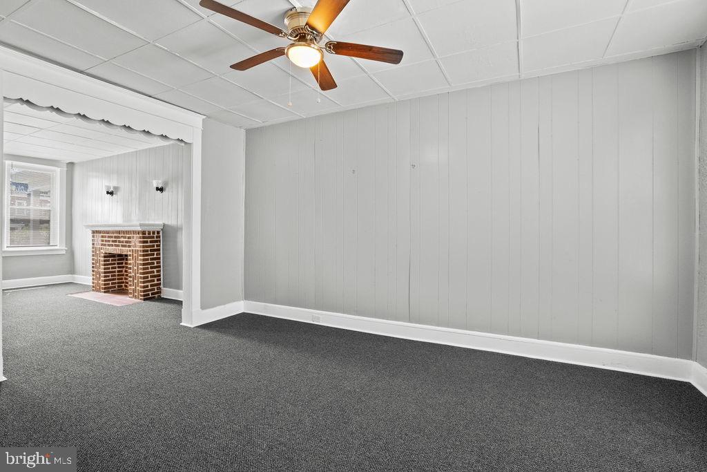 2424 West Lafayette Avenue Baltimore, MD 21216 - Photo 8 of 19 an empty room with chandelier fan