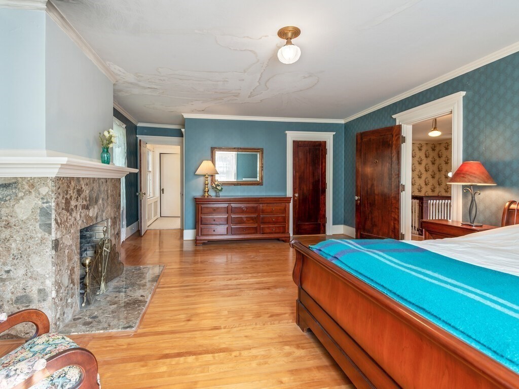 19 Kenilworth Road Worcester, MA 01602 - Photo 27 of 42 a room with fireplace furniture and a ceiling fan