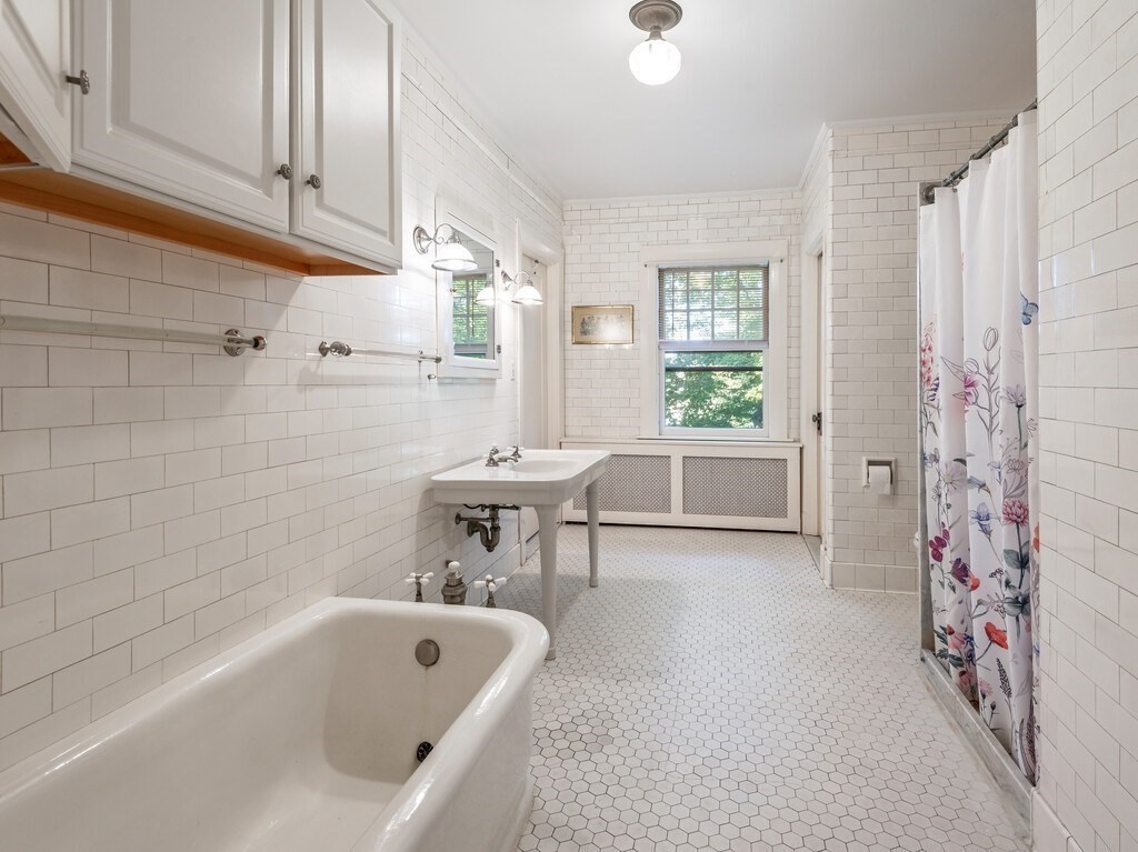 19 Kenilworth Road Worcester, MA 01602 - Photo 29 of 42 a bathroom with a bathtub and a shower