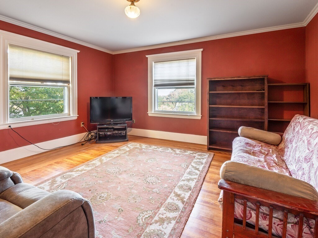 19 Kenilworth Road Worcester, MA 01602 - Photo 30 of 42 a bedroom with furniture and a flat screen tv