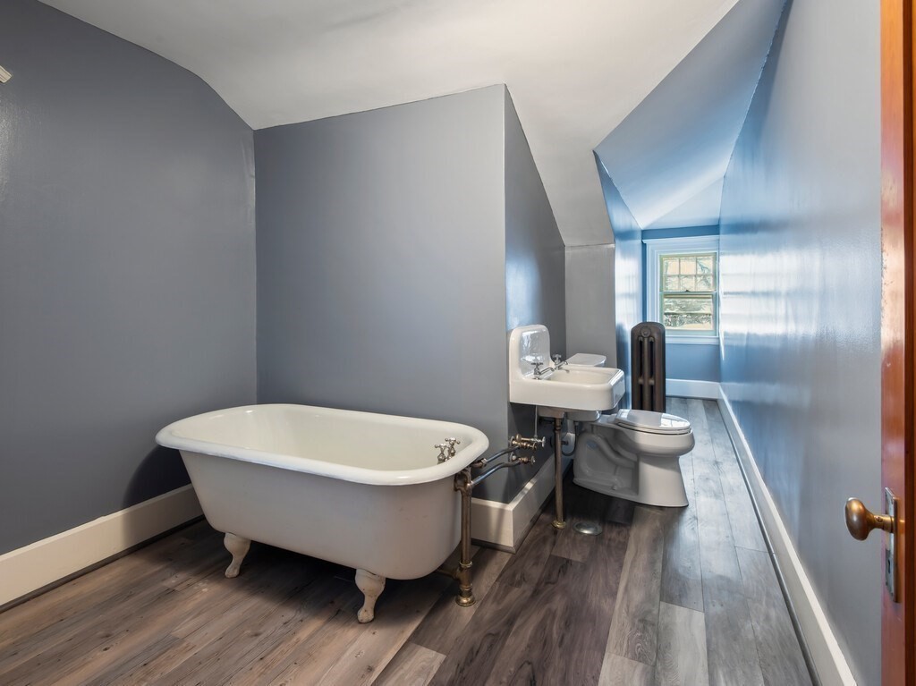 19 Kenilworth Road Worcester, MA 01602 - Photo 39 of 42 a spacious bathroom with a white tub and shower