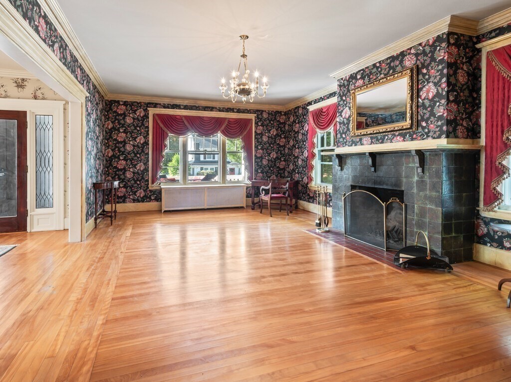 19 Kenilworth Road Worcester, MA 01602 - Photo 7 of 42 a living room with furniture mirror and a fireplace
