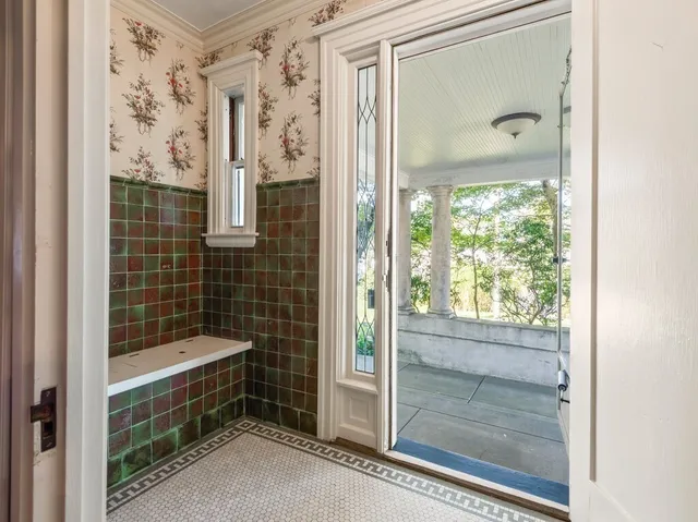 a bathroom with a bathtub and shower