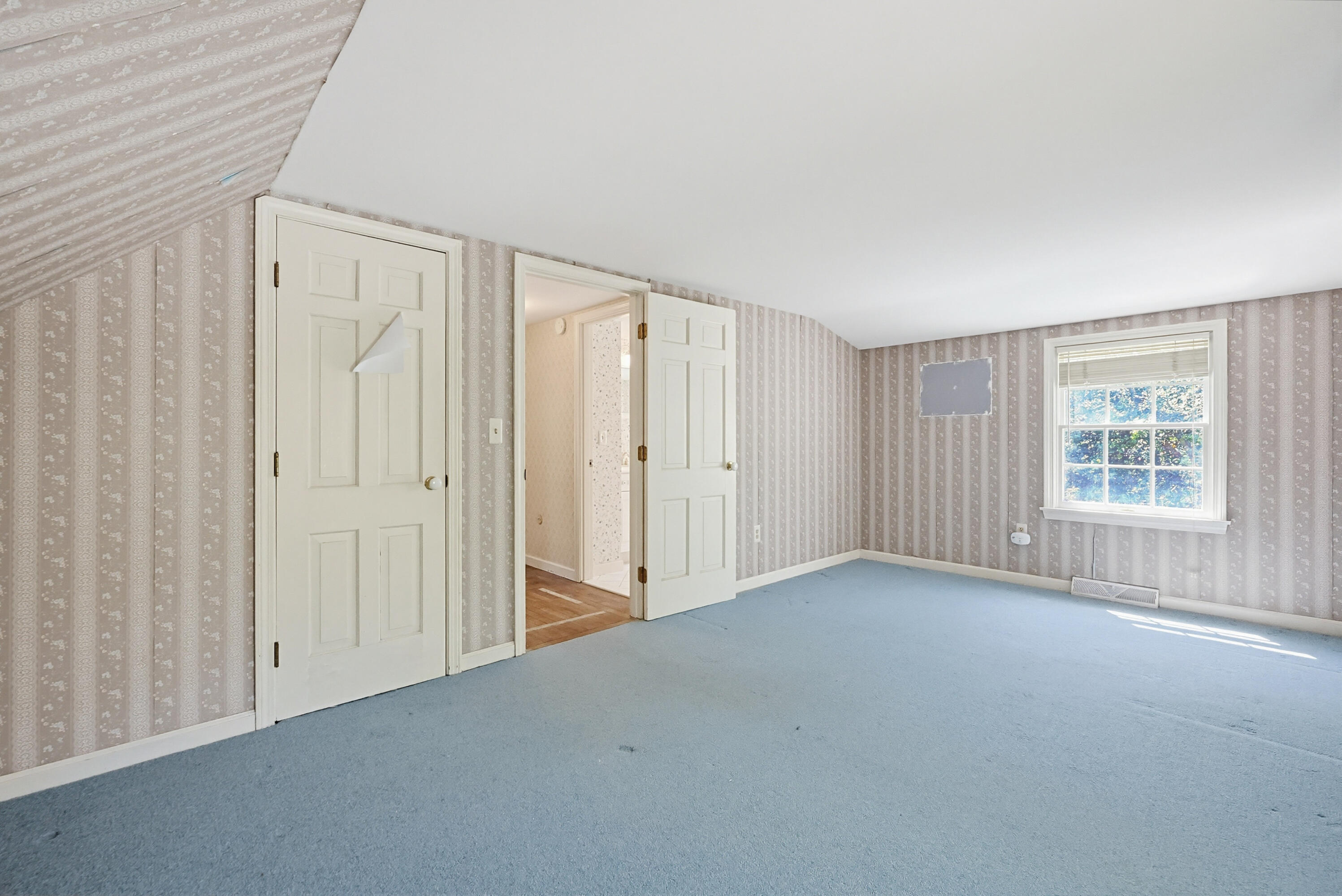 556 Cotuit Road Mashpee, MA 02649 - Photo 27 of 45 a view of a livingroom with an empty space and a window