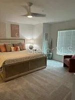 a bedroom with bed and window