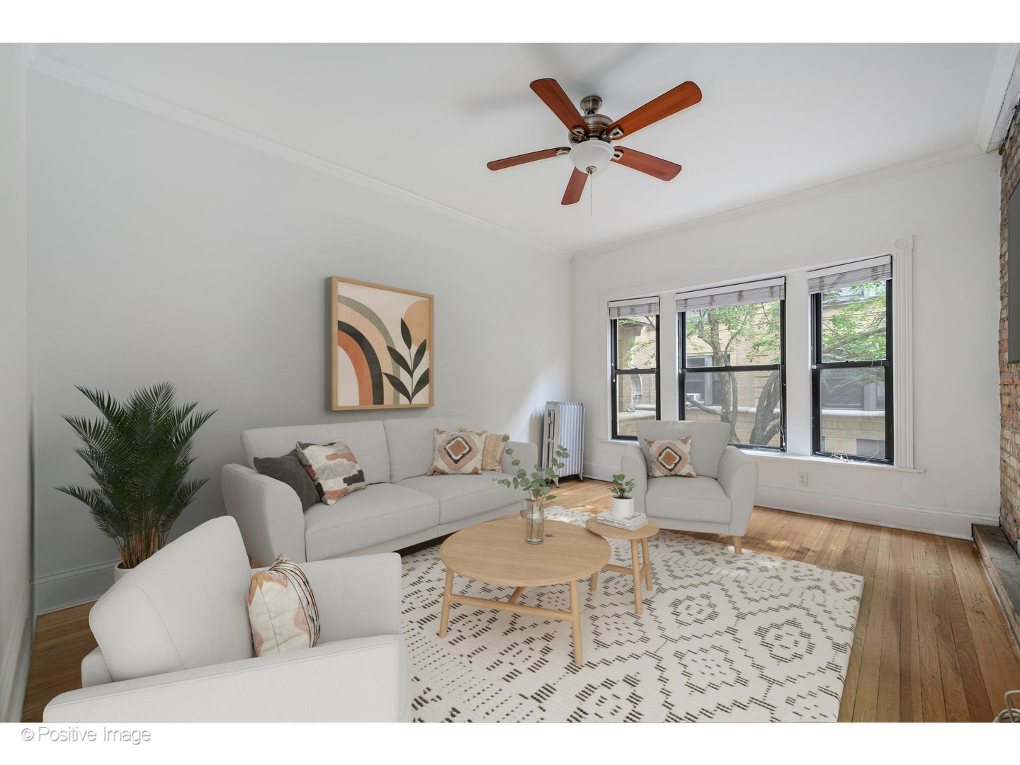726 West Sheridan Road, Unit 1N Chicago, IL 60613 - Photo 4 of 14 a living room with furniture and a large window
