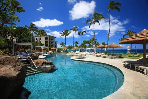 a view of a swimming pool with a patio