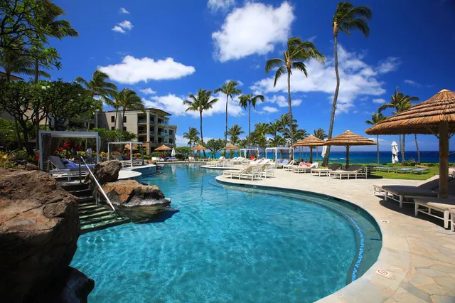 a view of a swimming pool with a patio