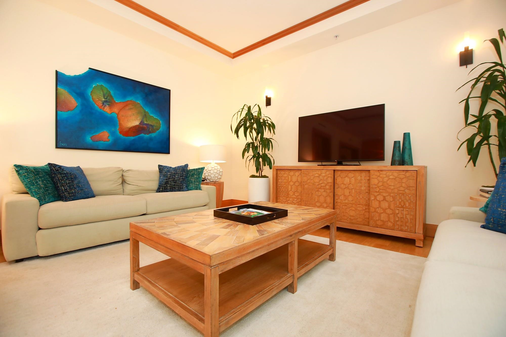 1 Bay Drive, Unit 2202 Lahaina, HI 96761 - Photo 16 of 50 a living room with furniture and a flat screen tv