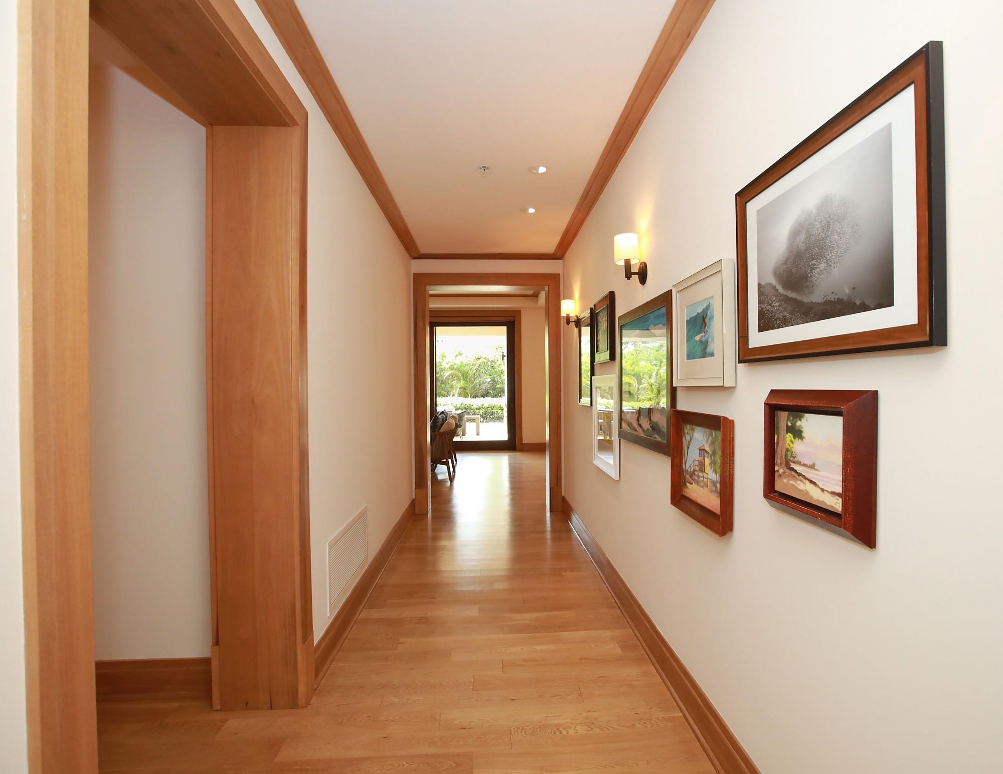 1 Bay Drive, Unit 2202 Lahaina, HI 96761 - Photo 39 of 50 a hallway with wooden floor fireplace and windows