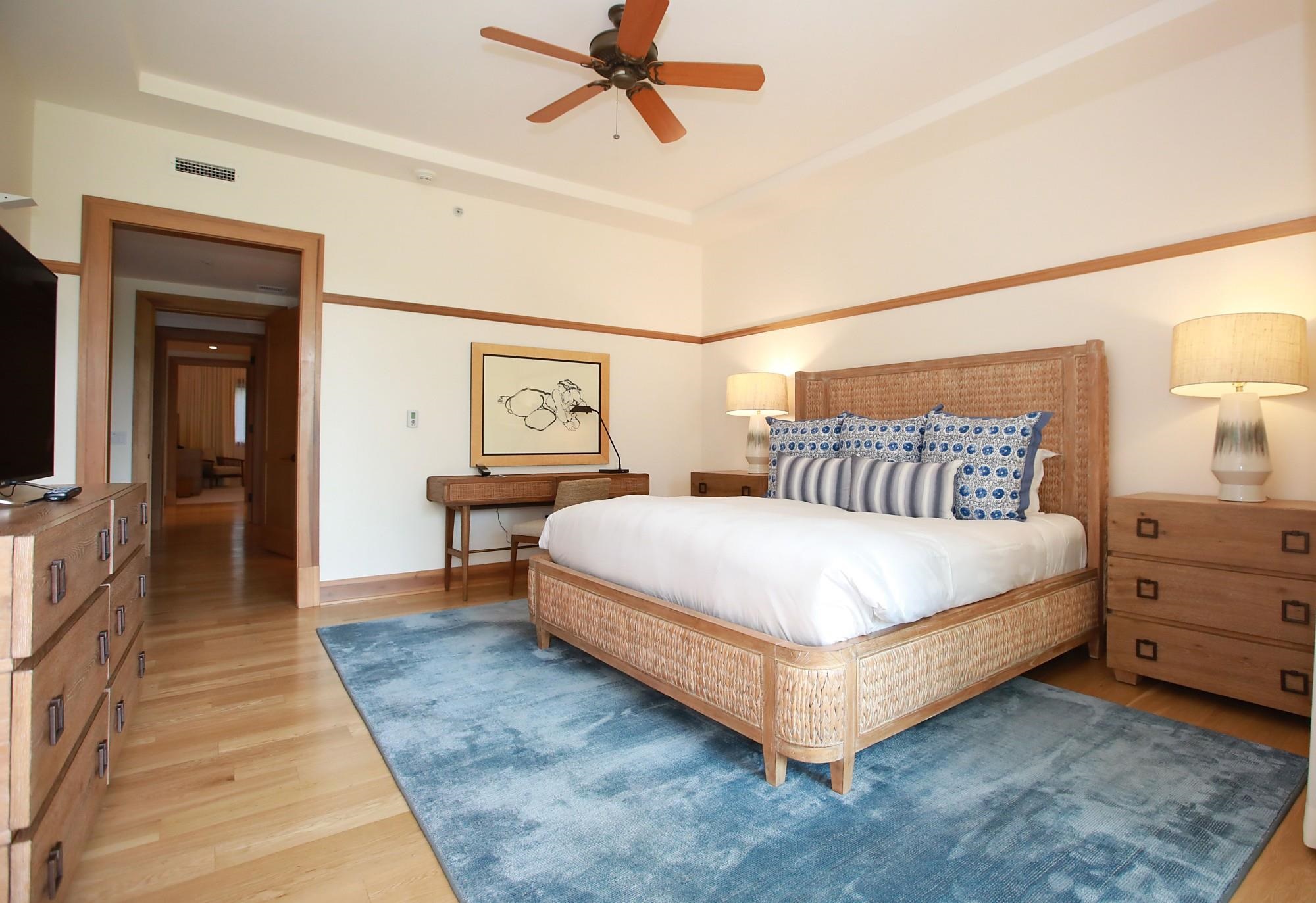 1 Bay Drive, Unit 2202 Lahaina, HI 96761 - Photo 6 of 50 a bedroom with a bed and a lamp on dresser