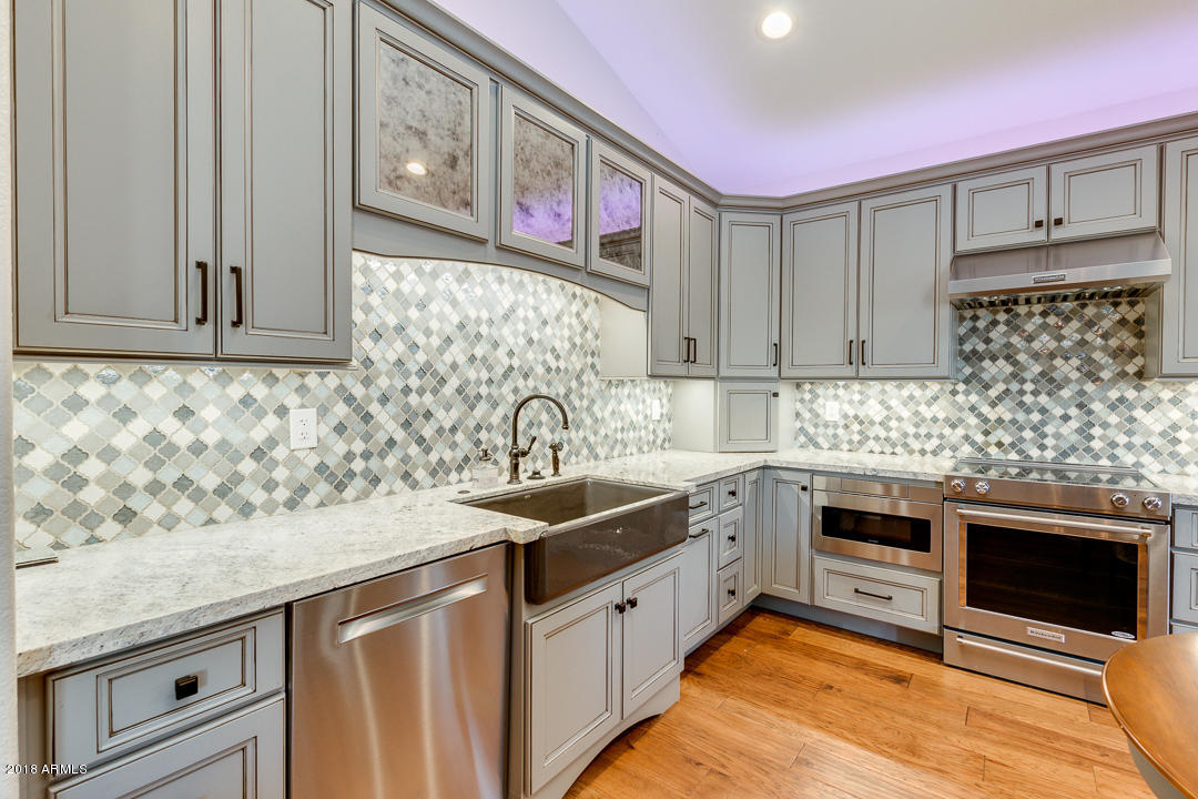3351 West Drake Street Chandler, AZ 85226 - Photo 8 of 20 a kitchen with stainless steel appliances granite countertop a sink and cabinets