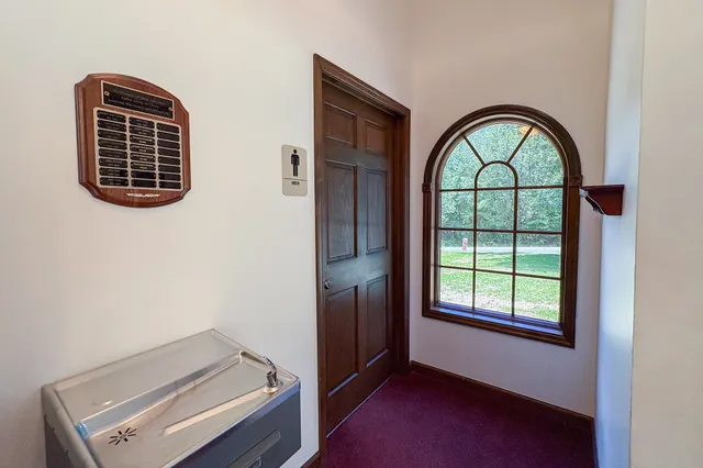 a view of an entryway with a door