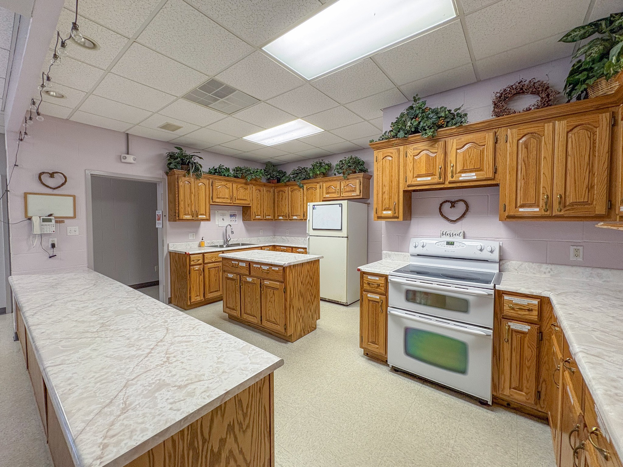 110 Hankins Road Hohenwald, TN 38462 - Photo 15 of 25 a kitchen that has a sink a stove and a refrigerator