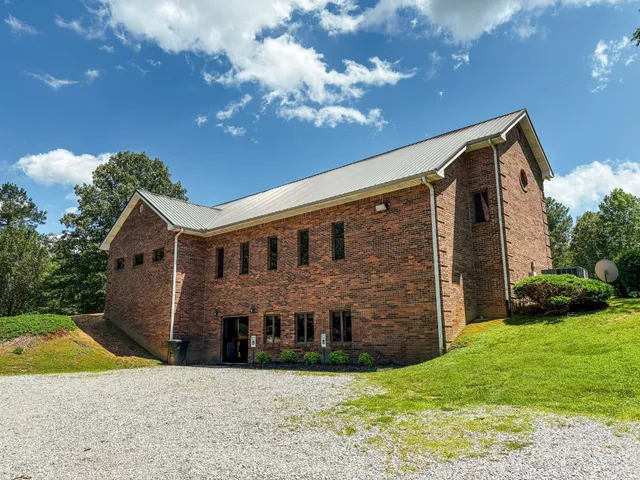a view of house with yard and green space