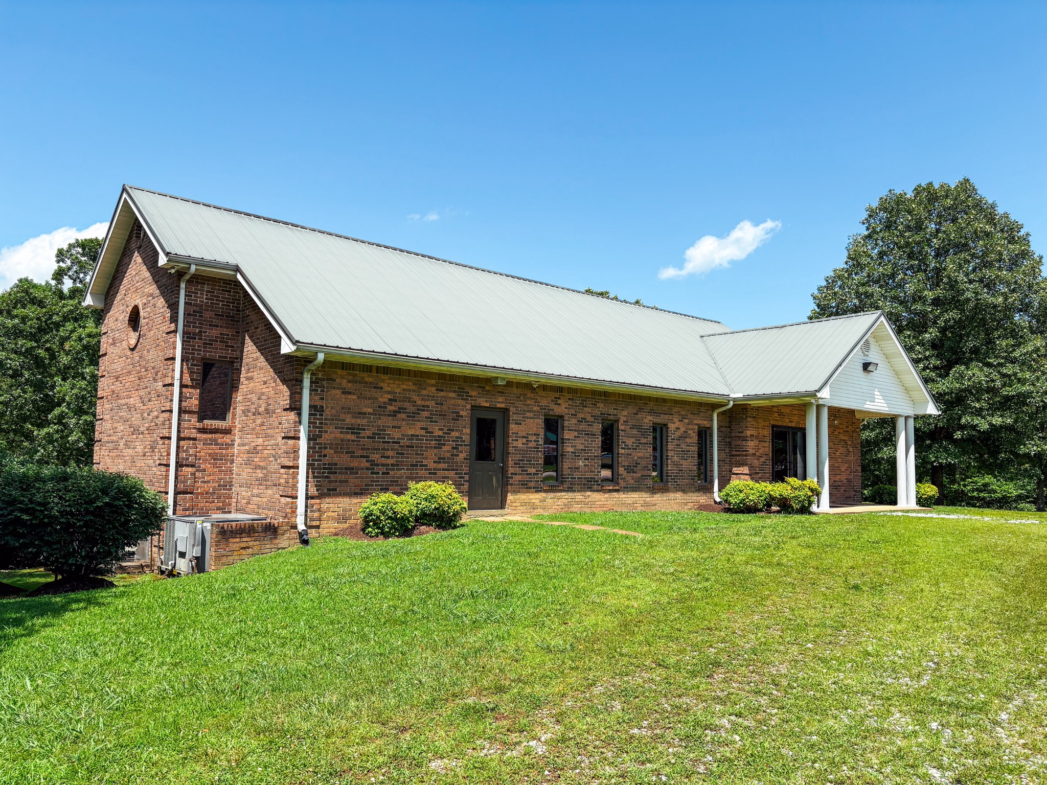 110 Hankins Road Hohenwald, TN 38462 - Photo 24 of 25 a view of a house with a yard and sitting area