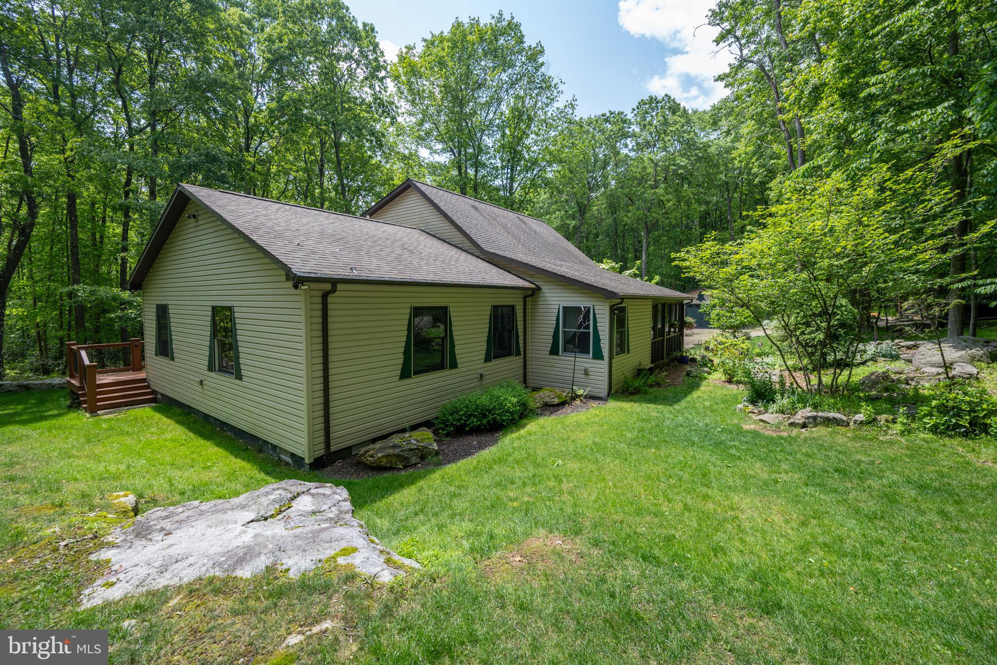 328 Stool Rock Road Oakland, MD 21550 - Photo 113 of 123 a view of a house with a big yard potted plants and large tree