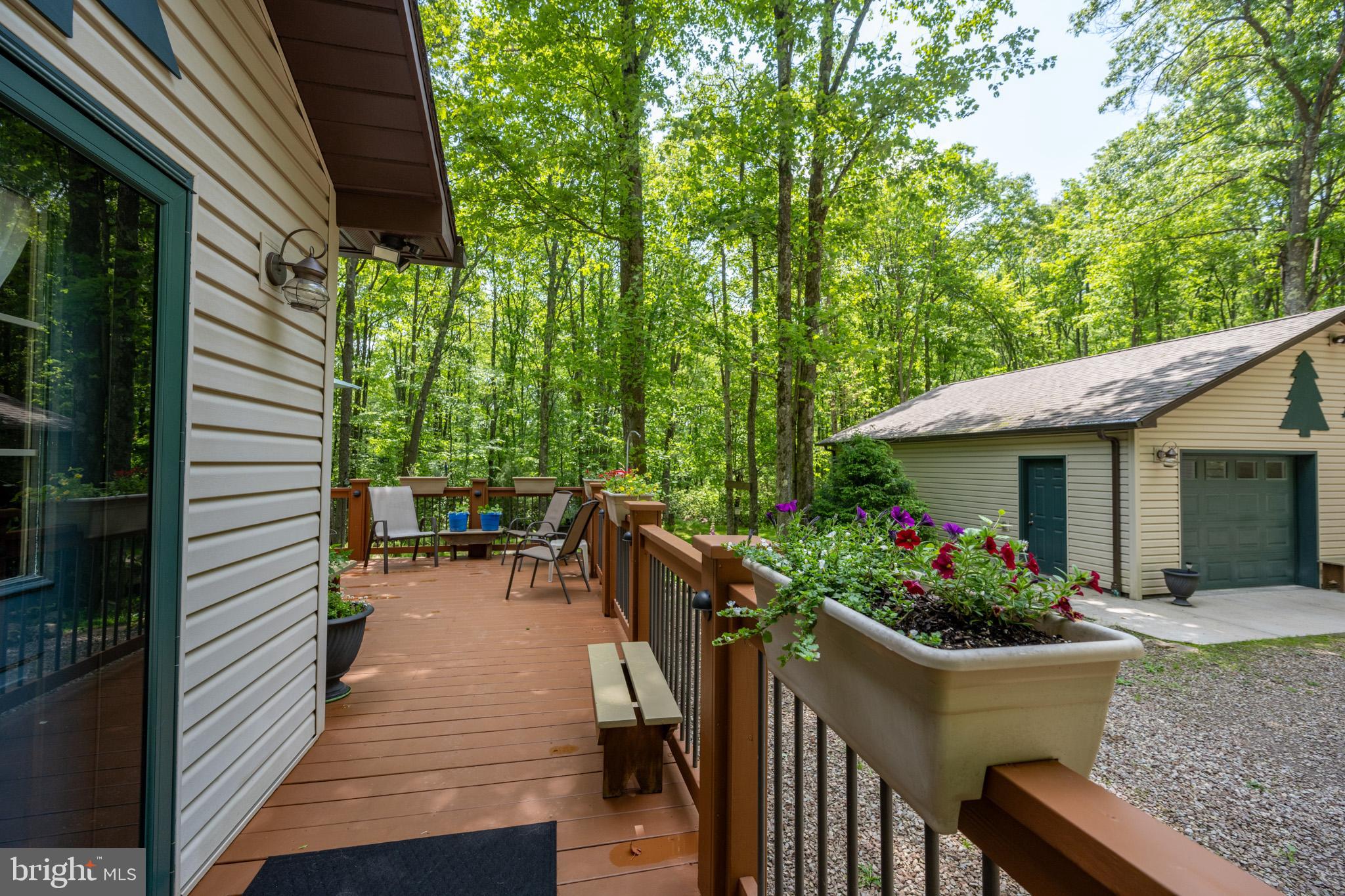 328 Stool Rock Road Oakland, MD 21550 - Photo 114 of 123 a view of a house with backyard and sitting area