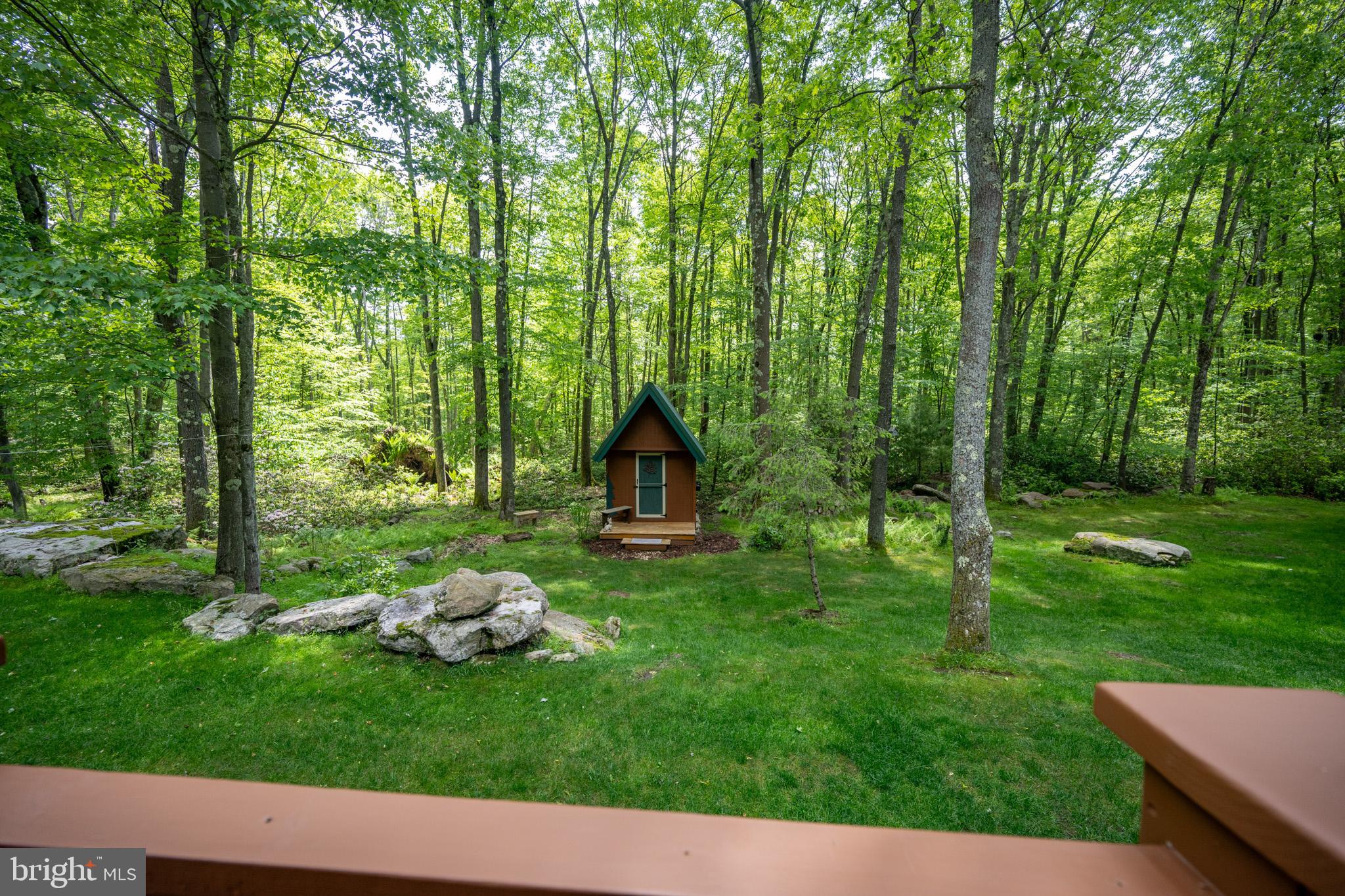 328 Stool Rock Road Oakland, MD 21550 - Photo 115 of 117 a backyard of a house with table and chairs