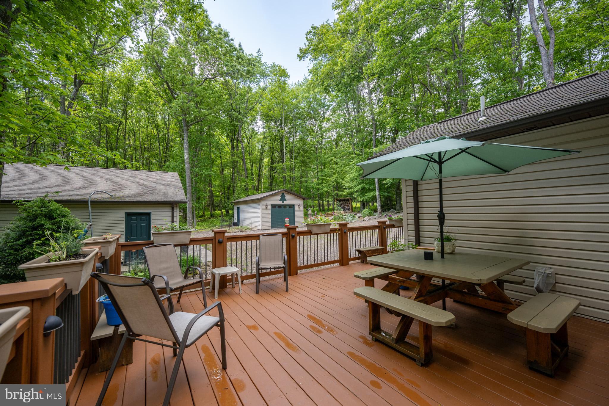 328 Stool Rock Road Oakland, MD 21550 - Photo 122 of 123 a view of a chairs and table on the deck