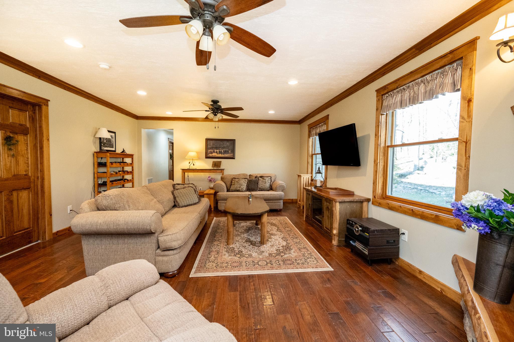328 Stool Rock Road Oakland, MD 21550 - Photo 44 of 117 a living room with furniture and a flat screen tv