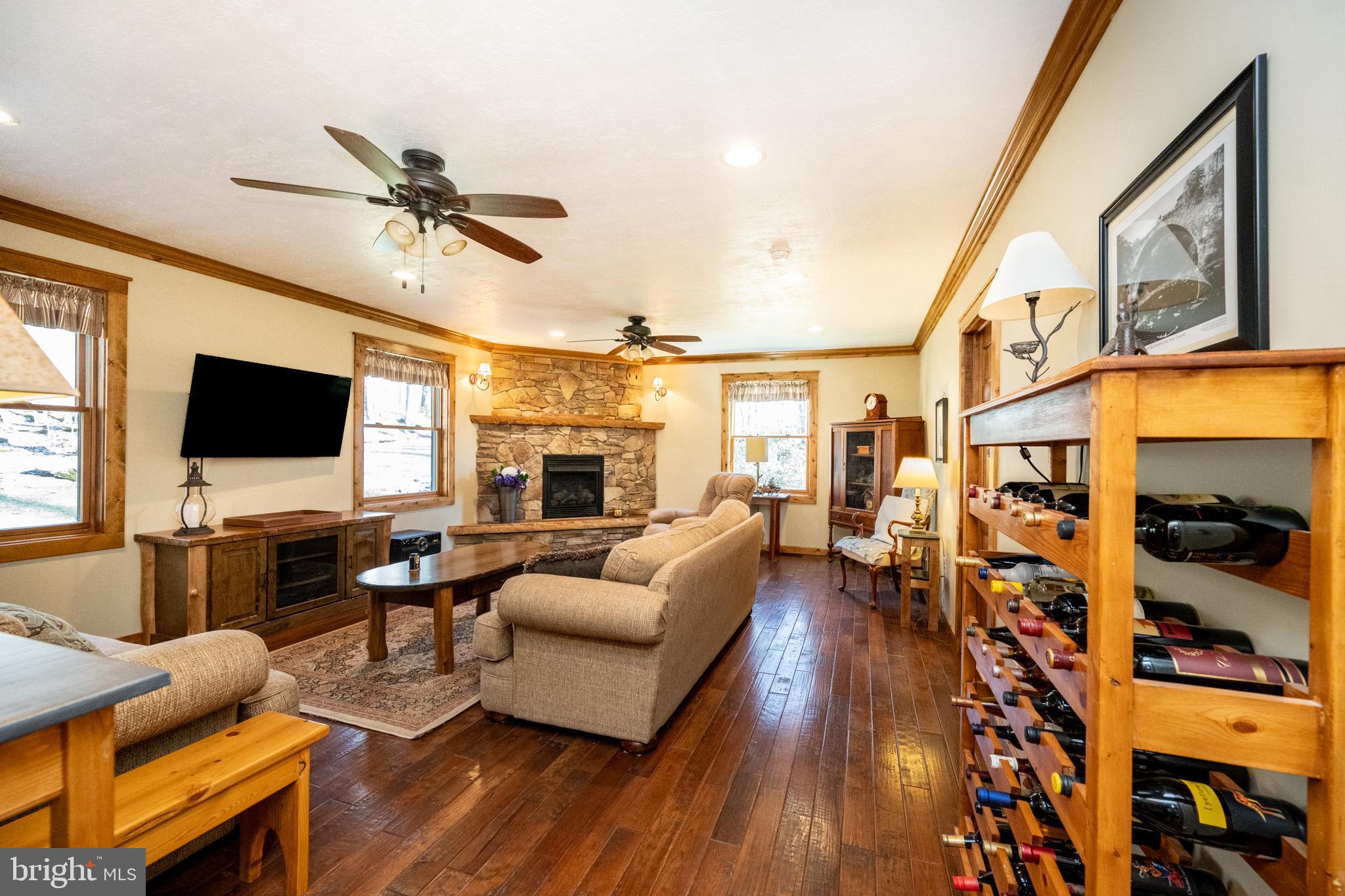 328 Stool Rock Road Oakland, MD 21550 - Photo 46 of 123 a living room with furniture and a flat screen tv
