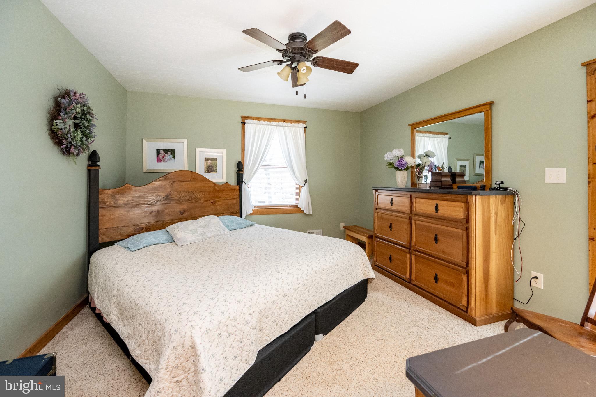 328 Stool Rock Road Oakland, MD 21550 - Photo 59 of 123 a bedroom with a bed and a dresser
