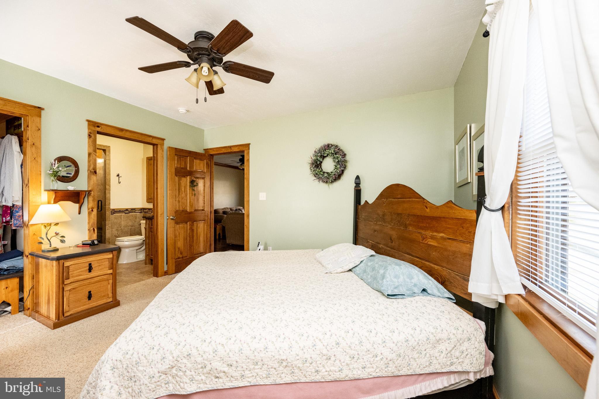 328 Stool Rock Road Oakland, MD 21550 - Photo 60 of 123 a bedroom with a bed and wooden floor