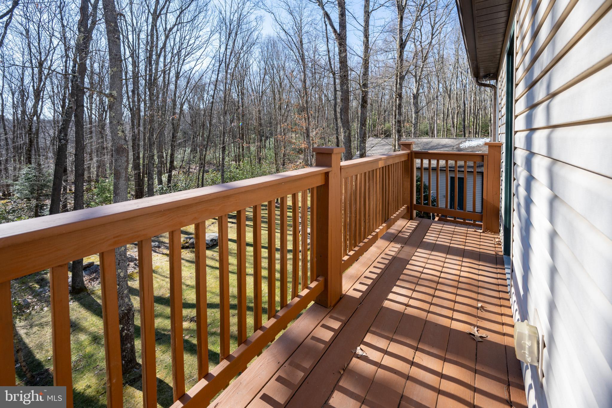 328 Stool Rock Road Oakland, MD 21550 - Photo 77 of 123 a balcony with trees in front of it