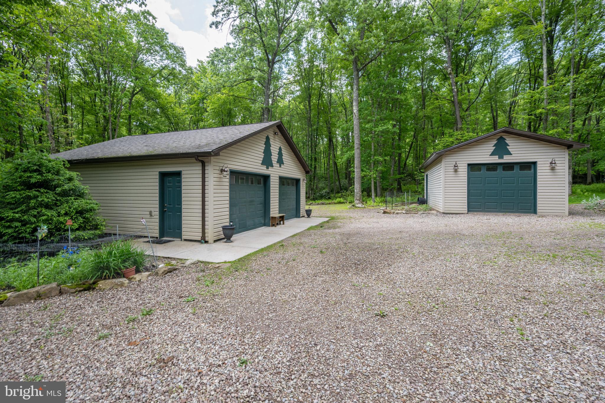 328 Stool Rock Road Oakland, MD 21550 - Photo 99 of 123 a view of a house with a yard and large trees